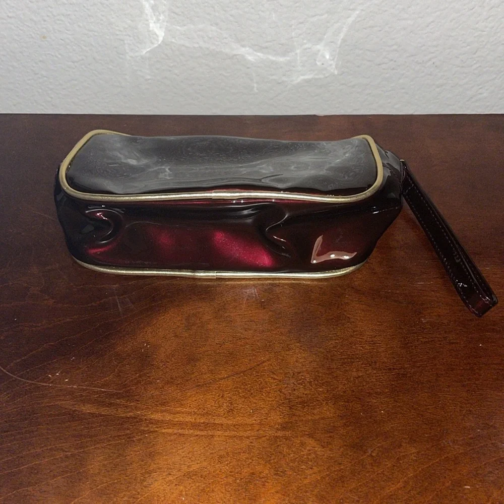Avon Irridescent Burgundy PVC Make Up Bag Wristlet Gold Trim 2003 NOS
